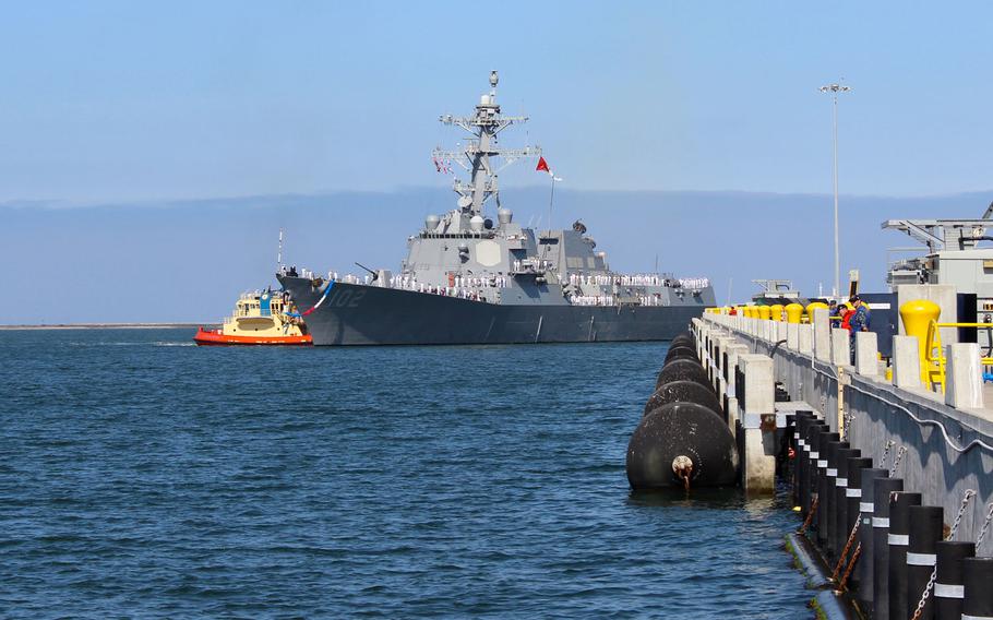 The USS Sampson nears the pier Monday morning, June 1, 2015, at Naval Base San Diego. The guided-missile destroyer was deployed to the Western Pacific for 7 months and assisted in the search-and-recovery efforts for AirAsia flight 8501.