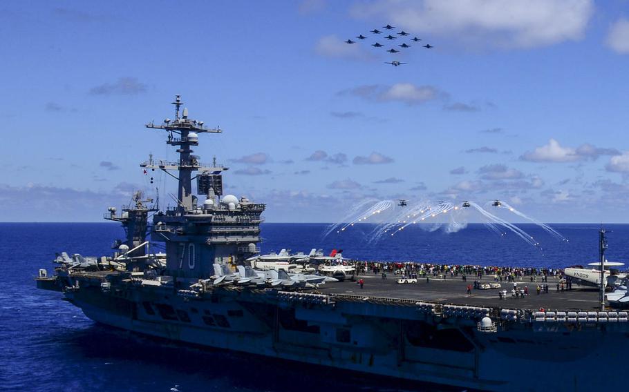 Aircraft assigned to Carrier Air Wing 17 fly in formation over the aircraft carrier USS Carl Vinson during an air power demonstration May 31, 2015. Carl Vinson returned to home port in San Diego, June 4, after a Middle East and western Pacific deployment. 
                