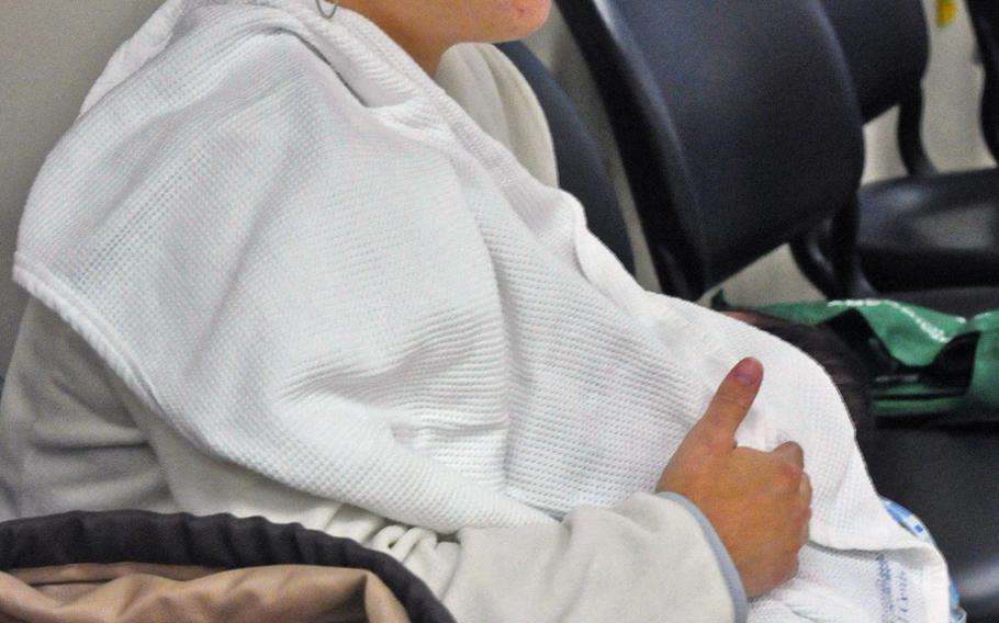 Sgt. Lizbeth Perez breastfeeds her 2-week-old daughter at Madigan Army Medical Center on Joint Base Lewis-McChord, Wash., in August 2011, during one of the hospital's Moms Own Milk group sessions.