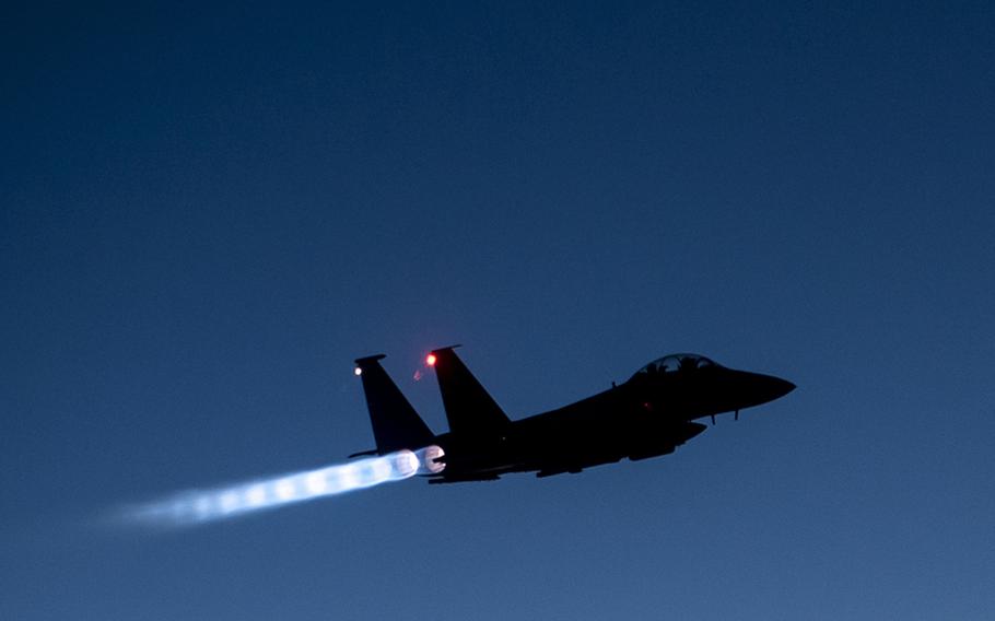 In this Sept. 23, 2014 file photo, a U.S. Air Force F-15E Strike Eagle flies over northern Iraq early in the morning after conducting airstrikes in Syria.