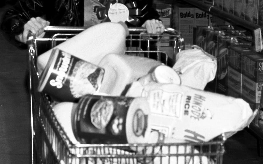Audrey Harano's shopping cart is filled during the shopping spree at the Aschaffenburg Commissary in 1981.