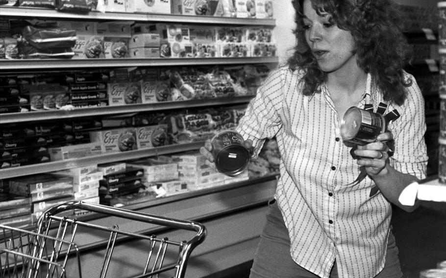 Mrs. Anthony Thomas stocks her shopping cart during the shopping spree at the Aschaffenburg Commissary in 1981.