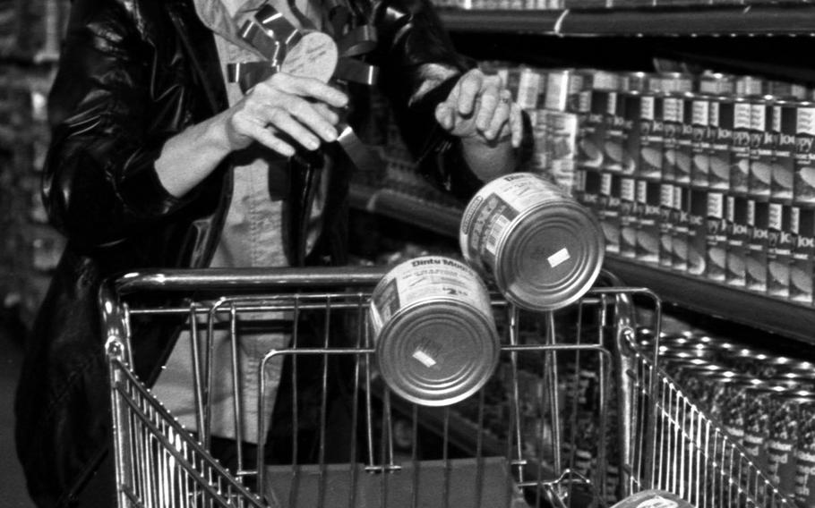 Audrey Harano tosses canned goods into her cart during the shopping spree at the Aschaffenburg Commissary in 1981.