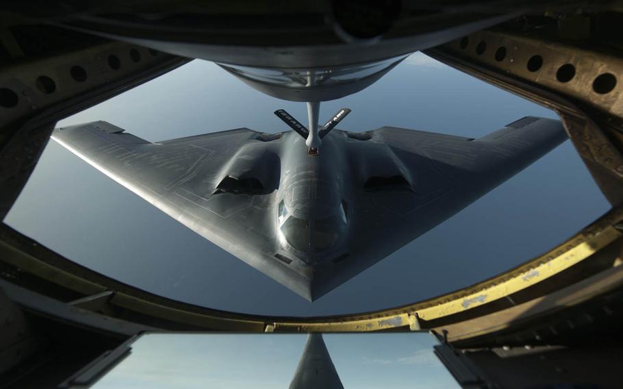 A B-2 Spirit flies into position on Wednesday, June 11, 2014, during a refueling mission over the northern Atlantic Ocean.