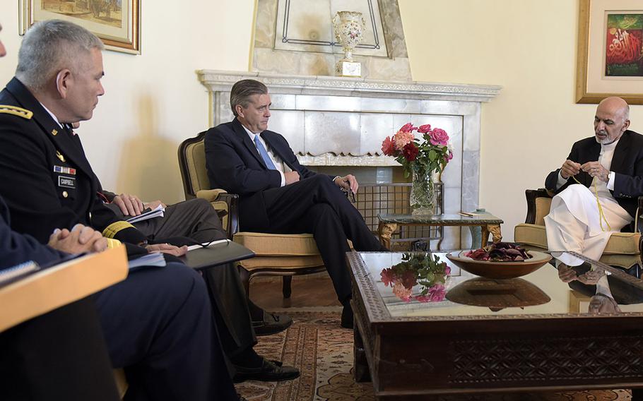 Gen. John F. Campbell, at left, meets with Afghan President Ashraf Ghani on Oct. 3, 2014 at the Presidential Palace in Kabul. Campbell is reported to have become a close adviser to Ghani.