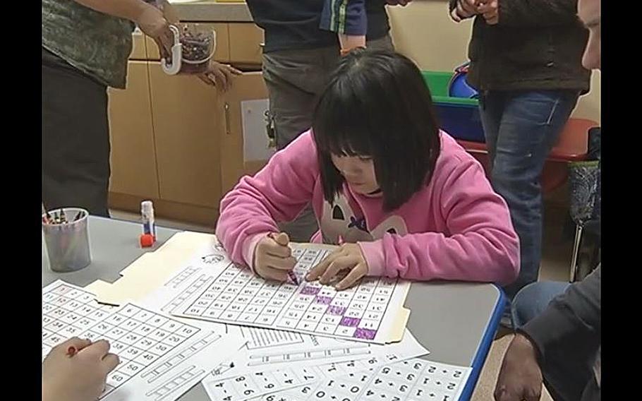 A video screen grab shows students at Casey Elementary School in South Korea taking part in a "Math Madness" event in January 2014.