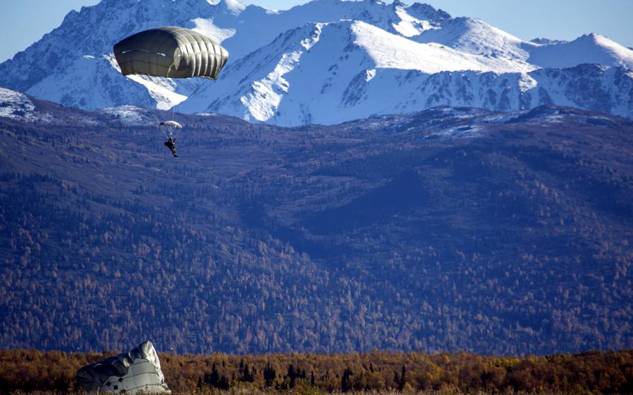A U.S. Army soldier assigned to 4th Infantry Brigade Combat Team (Airborne), 25th Infantry Division descends while conducting helicopter jump training over Malemute drop zone, Joint Base Elmendorf-Richardson, Alaska, Sept. 24, 2015. The soldiers of 4/25 are part of the Army’s only Pacific airborne brigade combat team.