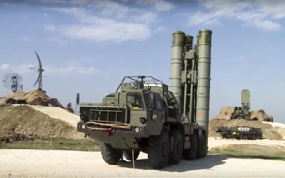 This photo made from the footage taken from Russian Defense Ministry official web site on Friday, Nov. 27, 2015, shows Russian S-400 air defense missiles being deployed at the Hemeimeem air base in Syria, about 50 kilometers (30 miles) south of the border with Turkey.