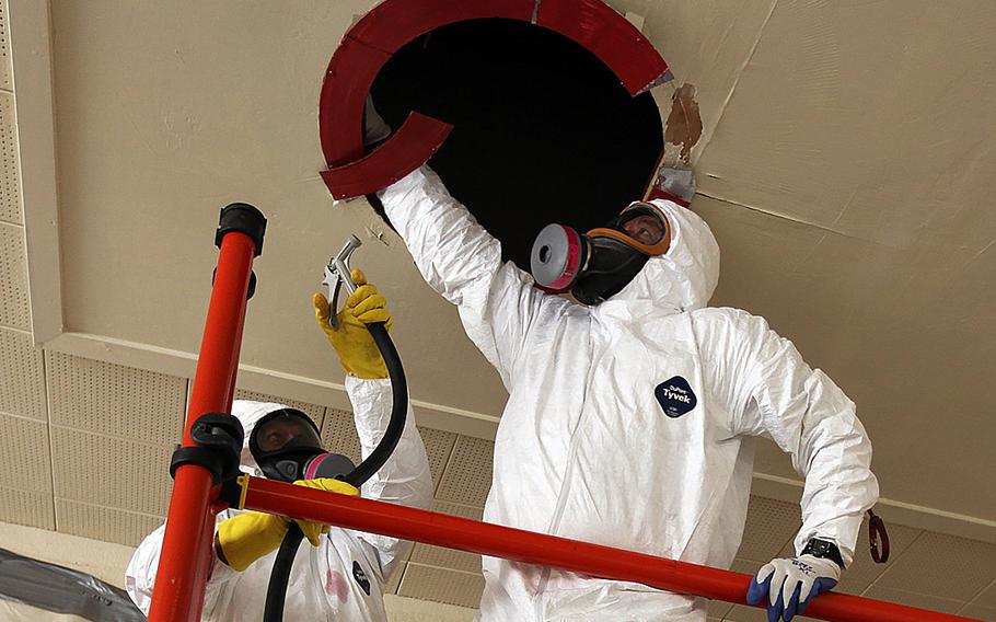 Naval Facilities Engineering Command Southwest public works employees inspect containment on an asbestos abatement project at Naval Base Coronado, Calif., on March 22, 2013. A bill moving through the House in January 2016 would hand the asbestos industry a key legal advantage when fighting the claims of terminally ill veterans, critics of the legislation say.