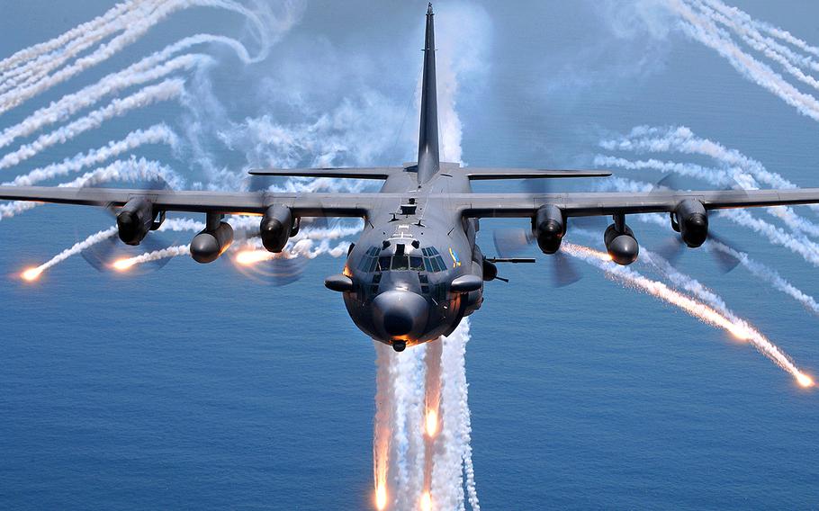 An AC-130H gunship jettisons flares as an infrared countermeasure during a training exercise on Aug. 24, 2007.