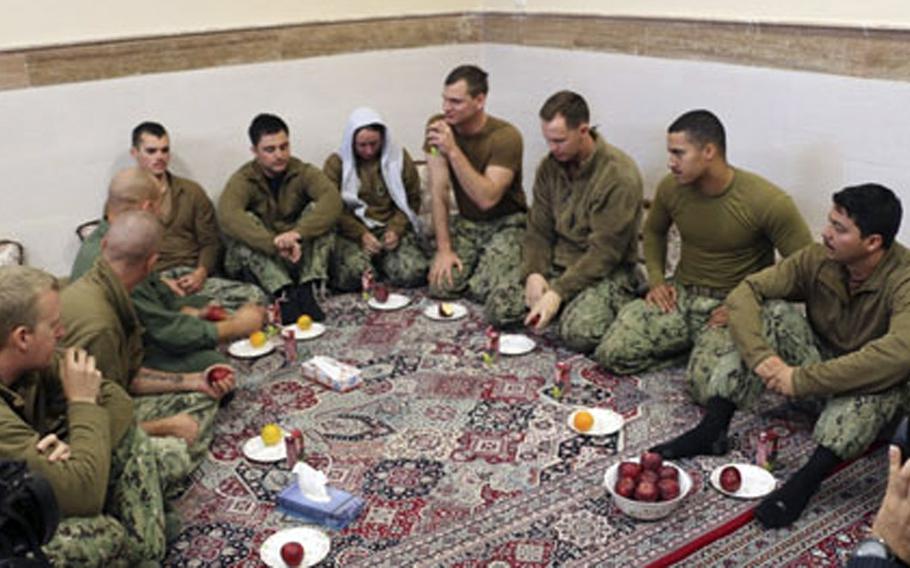 This picture released by the Iranian Revolutionary Guards on Wednesday, Jan. 13, 2016, shows detained American Navy sailors in an undisclosed location in Iran.