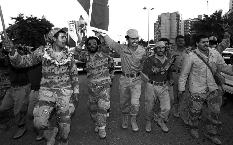 Kuwaiti troops celebrate the liberation of Kuwait in February, 1991.