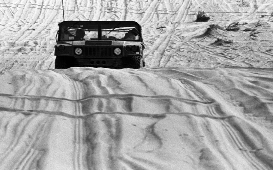 American forces push through the desert on the way to Kuwait City during the liberation of the country from Saddam Hussein's Iraqi conquerors in February, 1991.