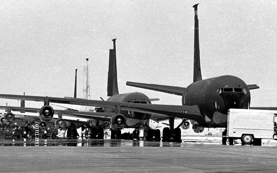 KC-135 tankers are poised for action near the flight line at an air base in central Saudi Arabia during Operation Desert Shield in November, 1990. Many of the planes were from the 909th Aerial Refueling Squadron out of Kadena Air Base, Okinawa; that week, the 909th was supporting a beach-assault drill on the shores of the Persian Gulf.