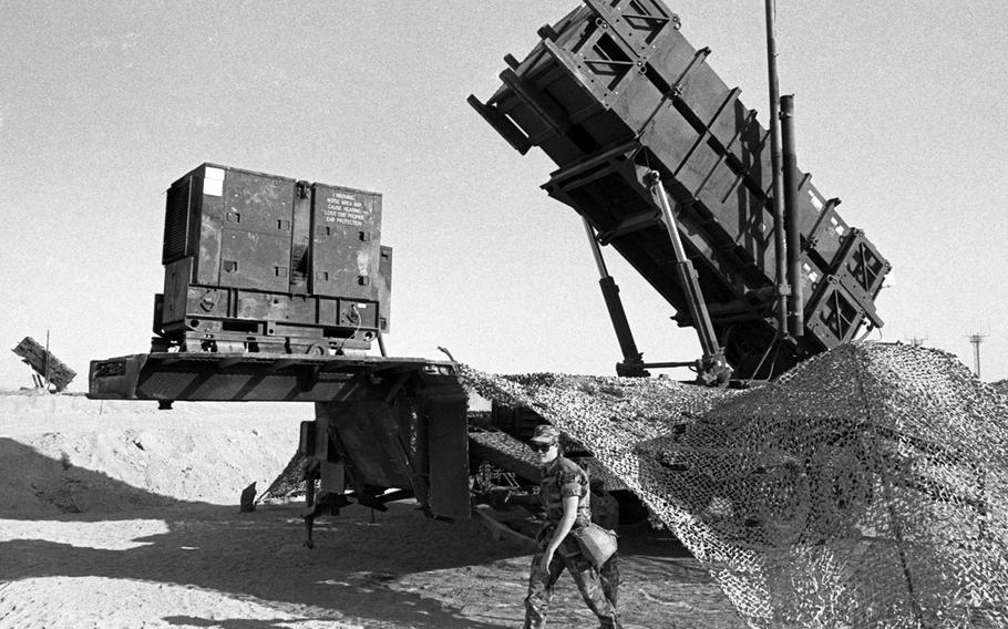 In December, 1990, a Patriot missile battery in the Saudi Arabian desert stands ready to fight off an attack by Saddam Hussein's Scud missiles during Operation Desert Shield.