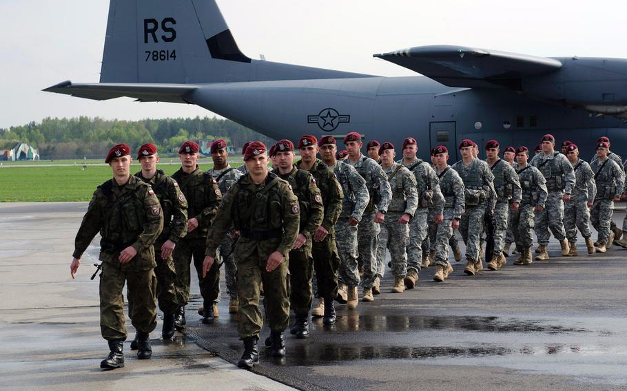 Paratroops from U.S. Army Europe's 173rd Infantry Brigade Combat Team (Airborne) march with their partners from the Polish army's 6th Airborne Brigade, in April 2014. NATO is likely to increase its presence in Poland, but the size and shape of that mission continue to be debated within the 28-nation U.S.-led alliance.