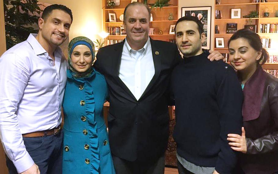 In a Monday, Jan. 18, 2016 photo provided by the Hekmati family, the family and U.S. Rep. Dan Kildee, D-Flint Township, Mich., are reunited with former Iran prisoner Amir Hekmati, second from right, at Landstuhl Regional Medical Center in Landstuhl, Germany. Left to right: brother-in-law Dr. Ramy Kurdi, sister Sarah Hekmati, Kildee, Amir Hekmati and sister Leila Hekmati.