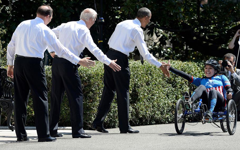 VA Secretary Bob McDonald, President Barack Obama and Vice President Joe Biden welcome veterans participating in the Wounded Warrior Project's Soldier Ride to the White House in celebration of the 8th annual Soldier Ride, April 16, 2015.