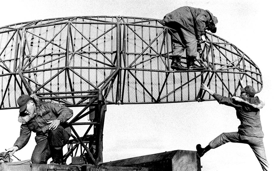 Troops from the 38th Artillery Brigade do maintenance work at a hilltop radar installation in South Korea in 1968.