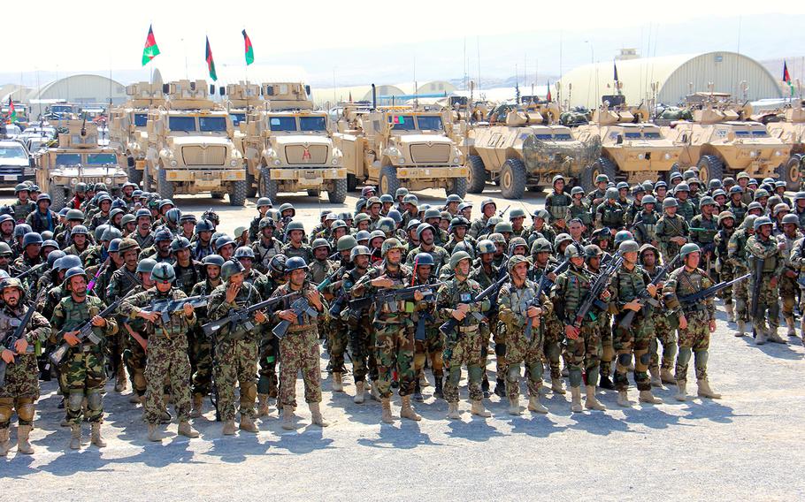 Soldiers from the Afghan National Army's 201 Corps stand formed and ready for inspection in full combat gear at Tactical Base Gamberi July 30, 2015.