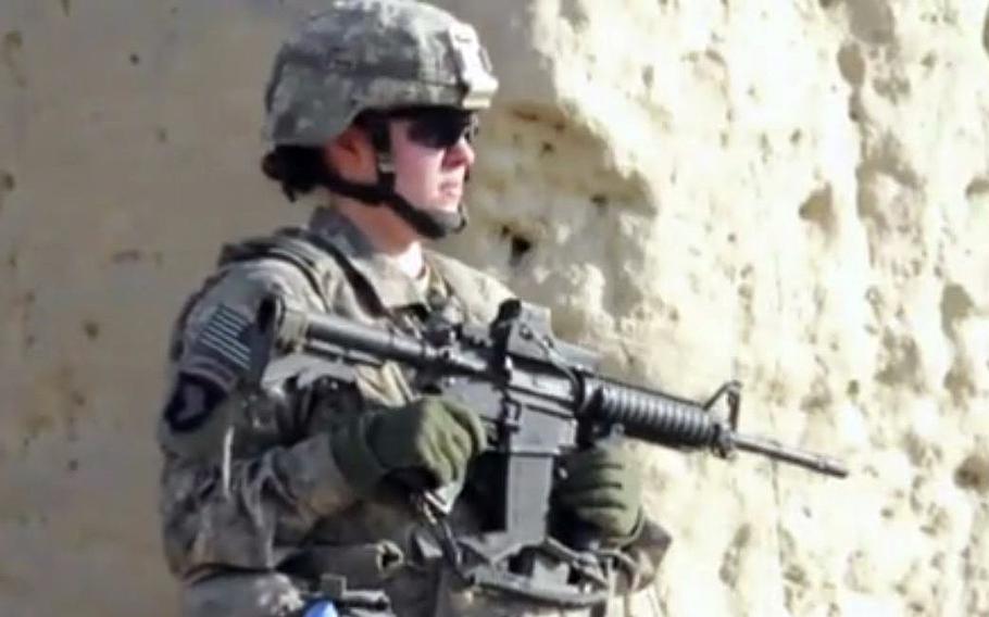 A video screen grab shows a female soldier wearing combat gear.