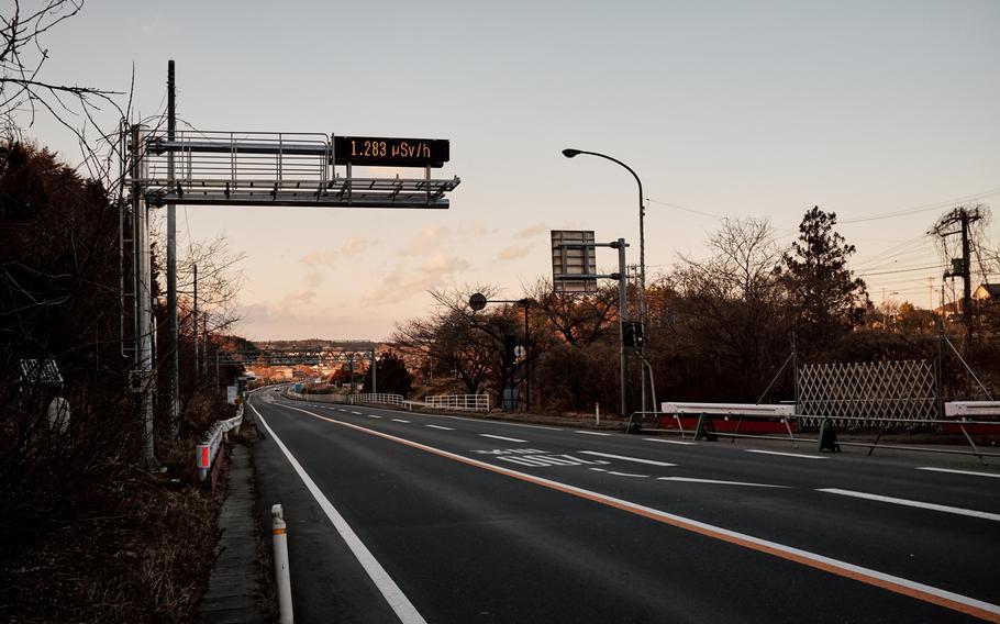 A road sign along the highway in the ghost town of Futaba, Japan, displays the current radiation level in the area, Feb. 10, 2016. This reading translates into roughly twice the normal amount of radiation a person would receive on a typical day. 
