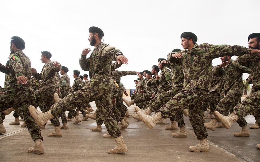 Afghan National Army soldiers assigned to the 215th Corps march during a graduation ceremony on Camp Shorabak, Helmand province, Afghanistan, March 28, 2013.