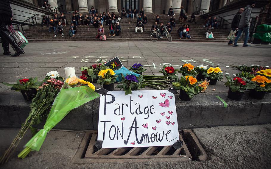 In the aftermath of the Brussels attacks, a sign reads "share your love" in front of the Bourse in Brussels on Tuesday, March 22, 2016.