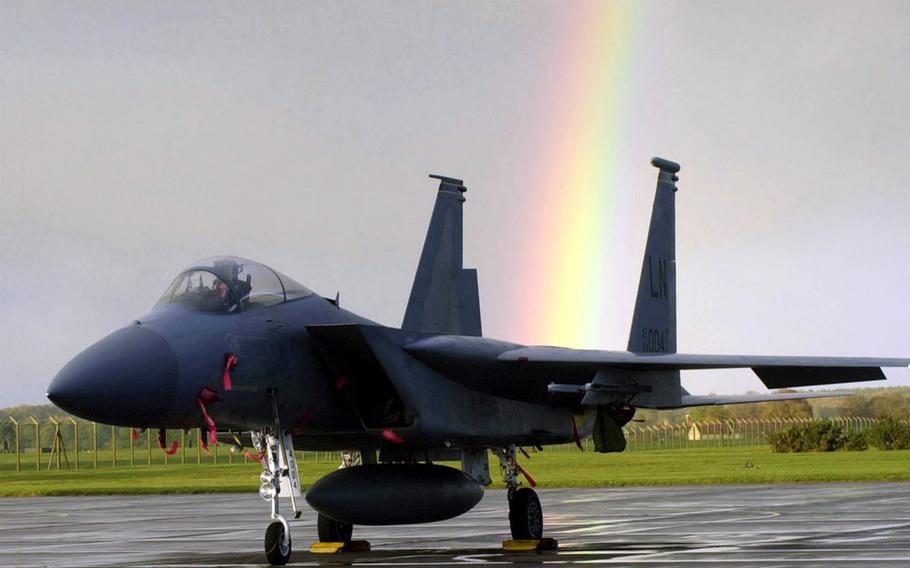 In a 2001 file photo, a rainbow stretches over an F-15C Eagle aircraft from the 493rd Fighter Squadron, 48th Fighter Wing, on the tarmac at RAF Lakenheath.