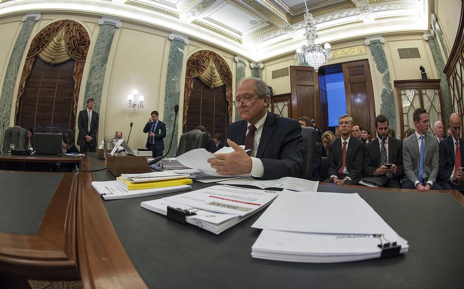 Special Inspector General for Afghanistan Reconstruction John Sopko looks over paperwork before the start of a Senate Armed Services Readiness and Management Support subcommittee hearing on Capitol Hill in Washington, D.C., on Wednesday, Jan. 20, 2016.