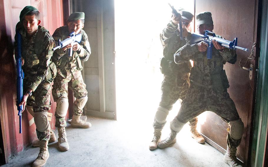Afghan Air Force soldiers practice room-clearing procedures during urban operations training Sept. 22 at Pohantoon-E-Hawayee “Air University,” Kabul International Airport, Afghanistan.