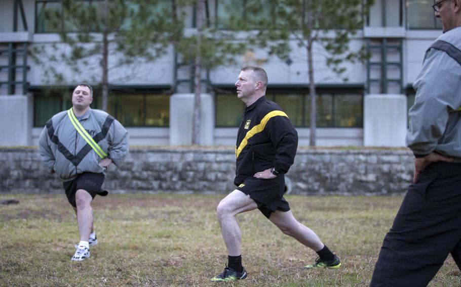 Command Sgt. Maj. James Wills, U.S. Army Reserve Command, and Soldiers of the Army Reserve Medical Command participate in a recovery drills after physical readiness training on a field near the C.W. Bill Young Armed Forces Reserve Center in Pinellas Park, Fla., Jan. 22, 2016.