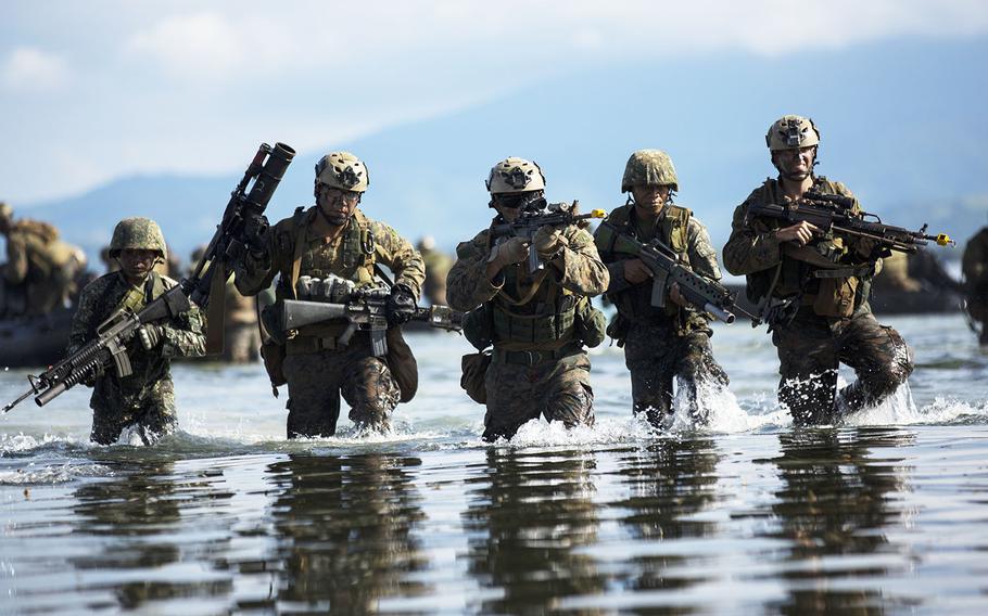 Philippine and U.S. Marines attack toward the beach during a simulated amphibious raid for Amphibious Landing Exercise (PHIBLEX) 15 in Palawan, Philippines, October 2, 2014.
