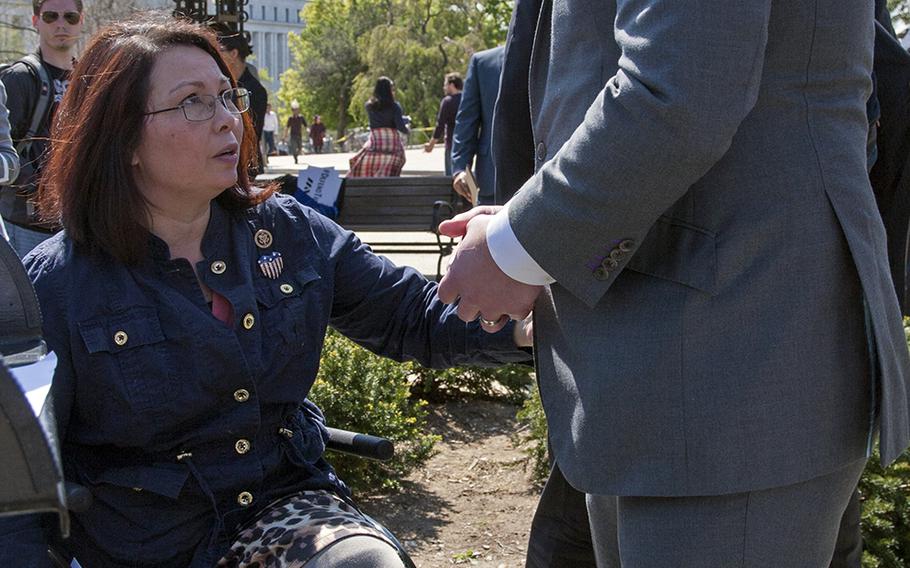 Paul Reickhoff, founder of Iraq and Afghanistan Veterans of America, speaks to Rep. Tammy Duckworth after defending the G.I. Bill during a press conference on April 14, 2016, near the Capitol Building. 