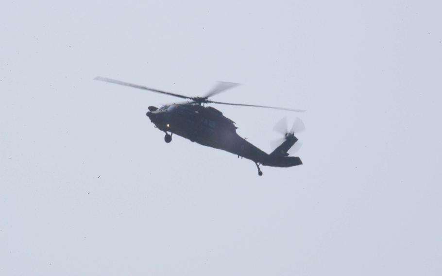 A Japan Ground Self Defense Force helicopter hovers over Kumamoto Airport on Tuesday, April 29, 2016. Japanese and U.S. troops have been ferrying supplies to the region after two strong earthquakes hit Japan last week.


