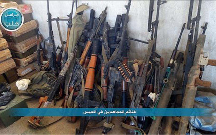 This image posted on the Twitter page of Syria's al-Qaida-linked Nusra Front on April 2, 2016, shows weapons captured by Nusra Front during the militants attack on the northern village of al-Ais in Aleppo province, Syria. 