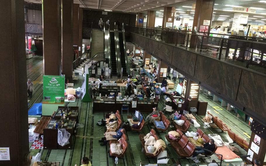 Earthquake survivors shelter inside an office building in central Kumamoto April 20, 2016.