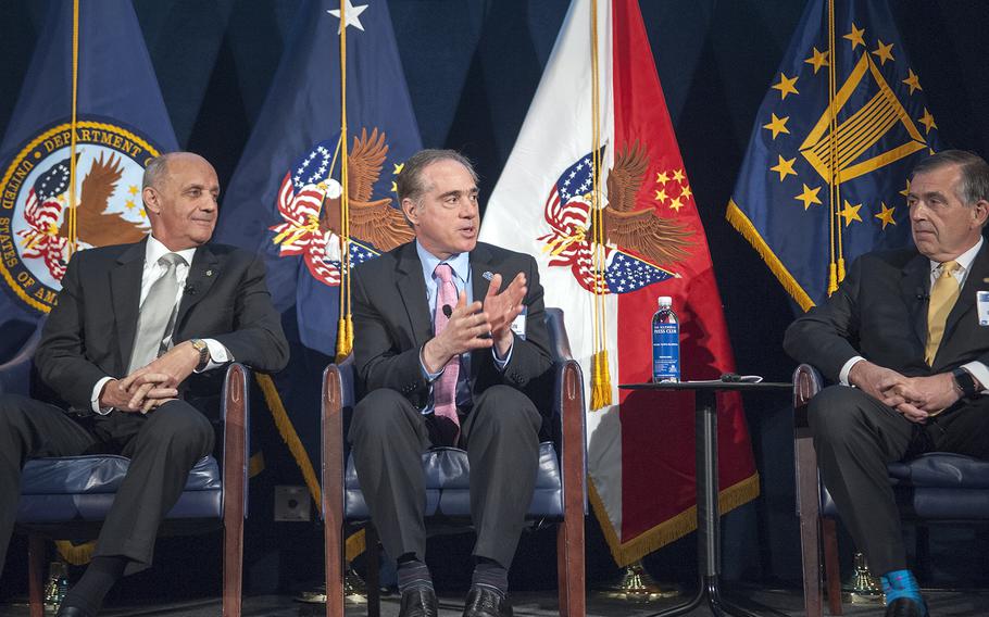Veterans Affairs' Under Secretary of Health David Shulkin, center, speaks during the Brain Trust Pathways to InnoVAtion summit held at the National Press Club in Washington, D.C., on Wednesday, April 20, 2016. Retired Army Gen. Peter Chiarelli, right, and former U.S. Surgeon General Richard Carmona joined Shulkin as part of an expert panel discussing emerging health-care technologies needed to care for veterans suffering from traumatic brain injuries.