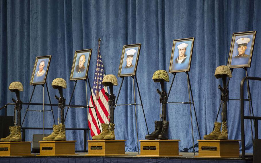 Battle crosses for fallen service members are displayed at the memorial service at University of Tennessee Chattanooga's McKenzie Arena in Chattanooga, Tenn., Aug. 15, 2015.