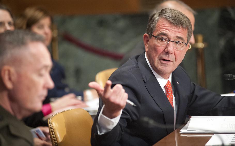 Defense Secretary Ash Carter drives home a point while testifying before the Senate appropriations subcommittee for defense on Wednesday, April 27, 2016, as Marine Corps Gen. Joseph Dunford, the Chairman of the Joint Chiefs of Staff listens in the foreground.
