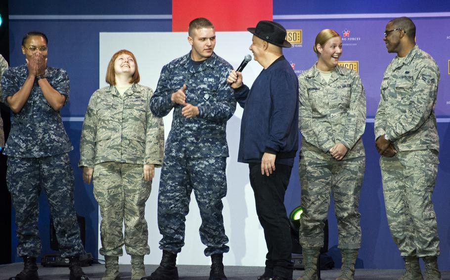 Jeff Ross, an American stand-up comedian known as the Roast Master General, interacts with servicemembers during “A Celebration of Service,” a comedy show presented by the USO, for Military Appreciation Month at Andrews Air Force Base on May 5, 2016.