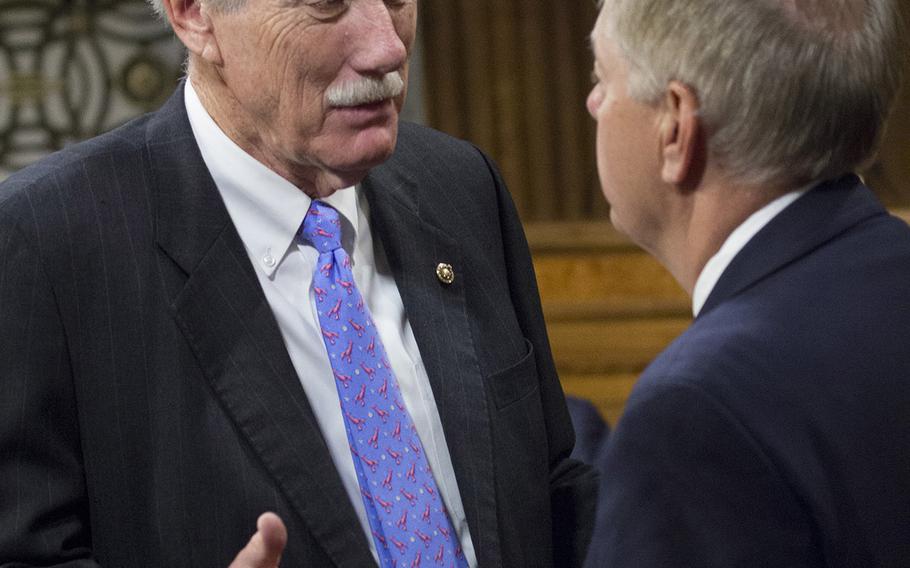 Sen. Angus King, I-Maine, talks with Senate Armed Services Subcommittee on Personnel Chairman Sen. Lindsey Graham, R-S.C., before a defense bill markup hearing on Capitol Hill, May 10, 2016.
