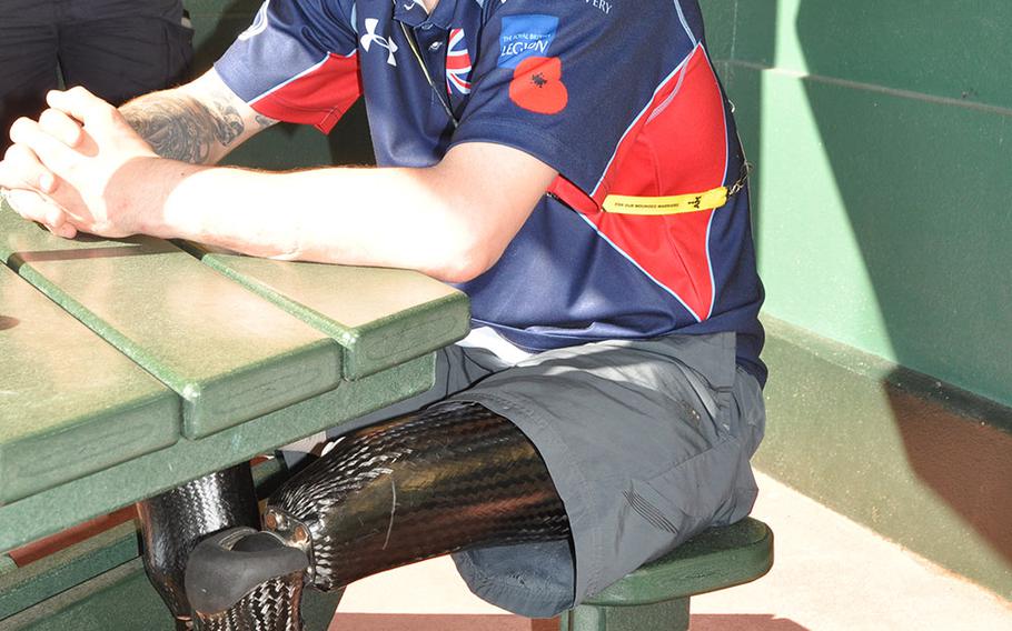 British double amputee Chris Middleton, a retired infantry private who lost both his legs to a bomb blast in Afghanistan in 2011, enjoys a moment in the shade at the Invictus Games Monday May 9, 2016. Middleto, who is on the wheelchair rugby and basketball teams, plans to take gold in Thursday's games.