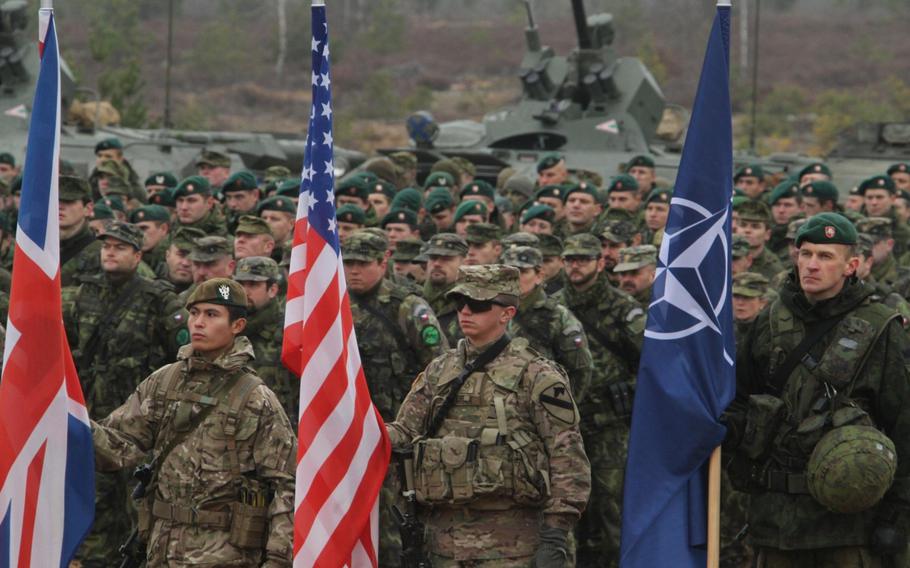 U.S. soldiers from the Fort Hood, Texas-based 2nd Battalion, 8th Cavalry Regiment, 1st Brigade Combat Team, 1st Cavalry Division, and the Vilseck, Germany-based 1st Squadron, 2nd Cavalry Regiment, participate in closing ceremonies for Iron Sword 2014, in Pabrade, Lithuania, Nov. 13, 2014. The 2nd Battalion, 8th Cavalry Regiment will become the face of an relocation of U.S. forces to areas south of Seoul.