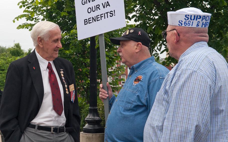 U.S. Navy Blue Water Vietnam veterans gathered near the U.S. Capitol on May 18, 2016, to rally in support of passage of a bill to regain benefits related to Agent Orange exposure. Col. Don Kaiserman, far left, past-president of Military Officers Association of America, stops to chat with two Vietnam veterans, Len Brzozowki, center, and Mike Yates.