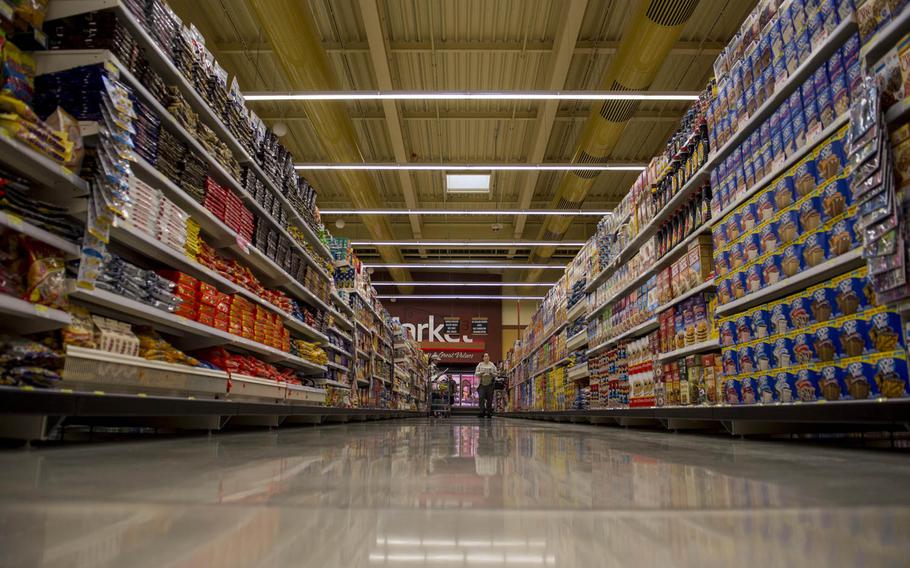 A customer walks down an aisle inside the new Spangdahlem commissary during the grand opening of the facility on Thursday, May 19, 2016, at Spangdahlem Air Base, Germany. Construction for the 54,000-square-foot facility started in February 2014 and was completed in February 2016.
                