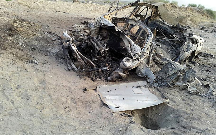 This photo taken by a freelance photographer Abdul Salam Khan using his smart phone on Sunday, May 22, 2016, purports to show the destroyed vehicle in which Mullah Akhtar Mansour was traveling in the Ahmad Wal area in Baluchistan province of Pakistan, near Afghanistan's border. The killing of the Taliban’s top leader by U.S. drones on Pakistani soil could signal that Washington is finally running out of patience over Islamabad’s failure to crack down on Afghan insurgents who use Pakistan as a sanctuary.