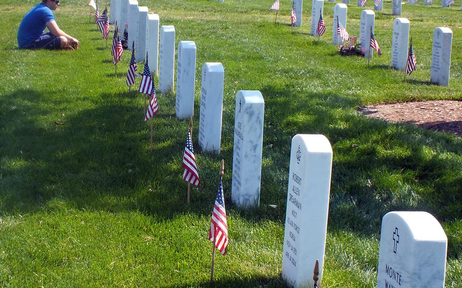 Quiet contemplation at Arlington National Cemetery on Memorial Day weekend 2016.