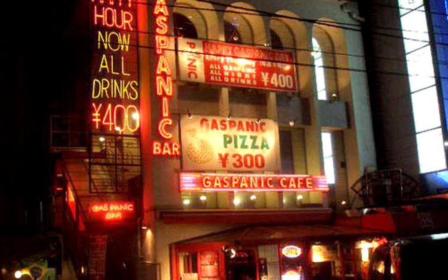 A sign in the Roppongi entertainment district of Tokyo advertises happy hour in this undated photo. Junior enlisted servicemembers stationed in Japan must now be accompanied after 10 p.m. when drinking alcoholic beverages off base, according to a new U.S. Forces Japan liberty policy.