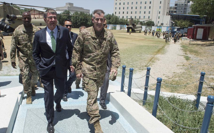 Secretary of Defense Ash Carter walks with Gen. John Nicholson, Resolute Support Mission Commander, in Kabul, Afghanistan July 12, 2016. Carter is in Afghanistan to meet with government leaders about Resolute Support.
